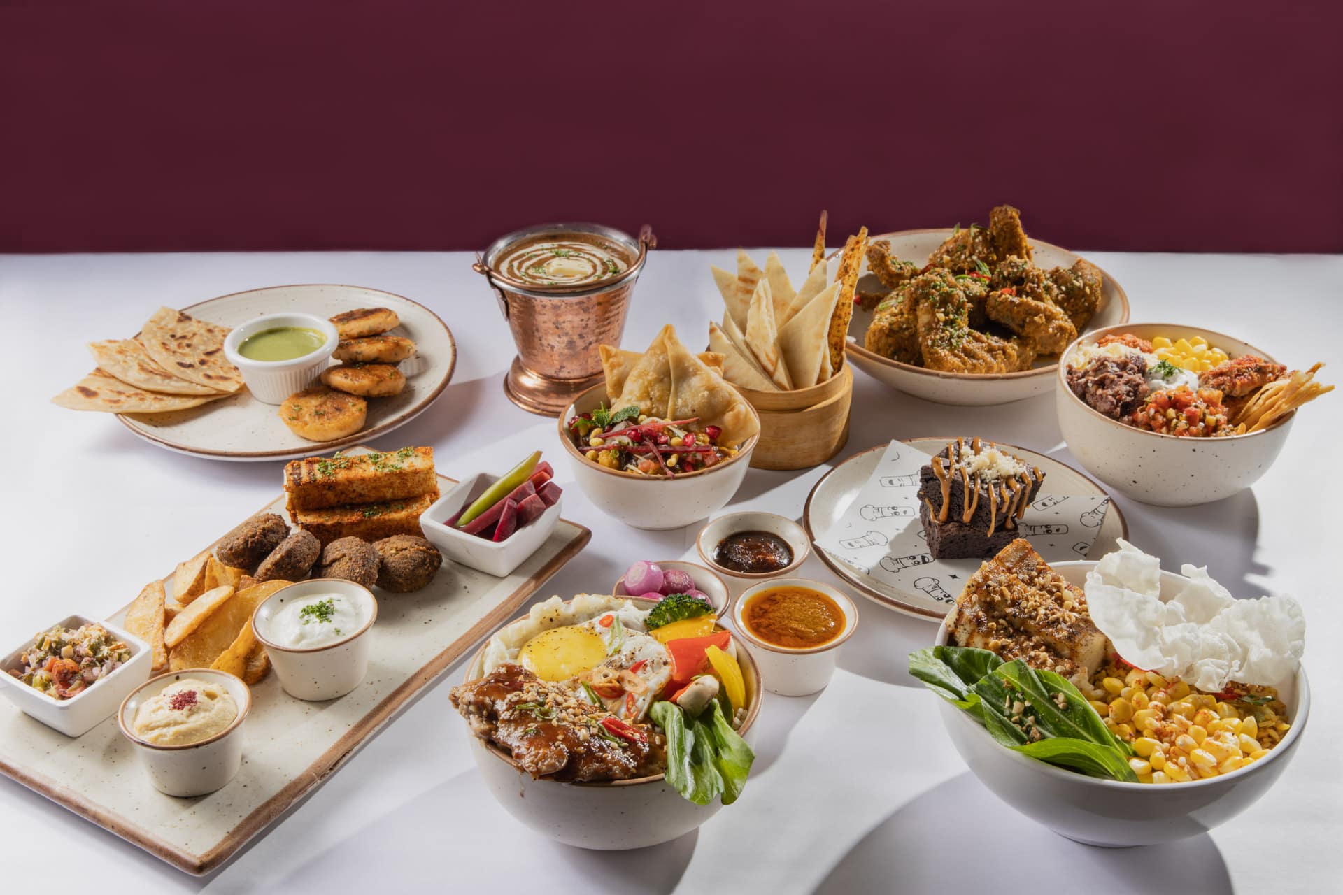 Chef Kenzo social catering spread with mezze, snacks, and gourmet desserts
