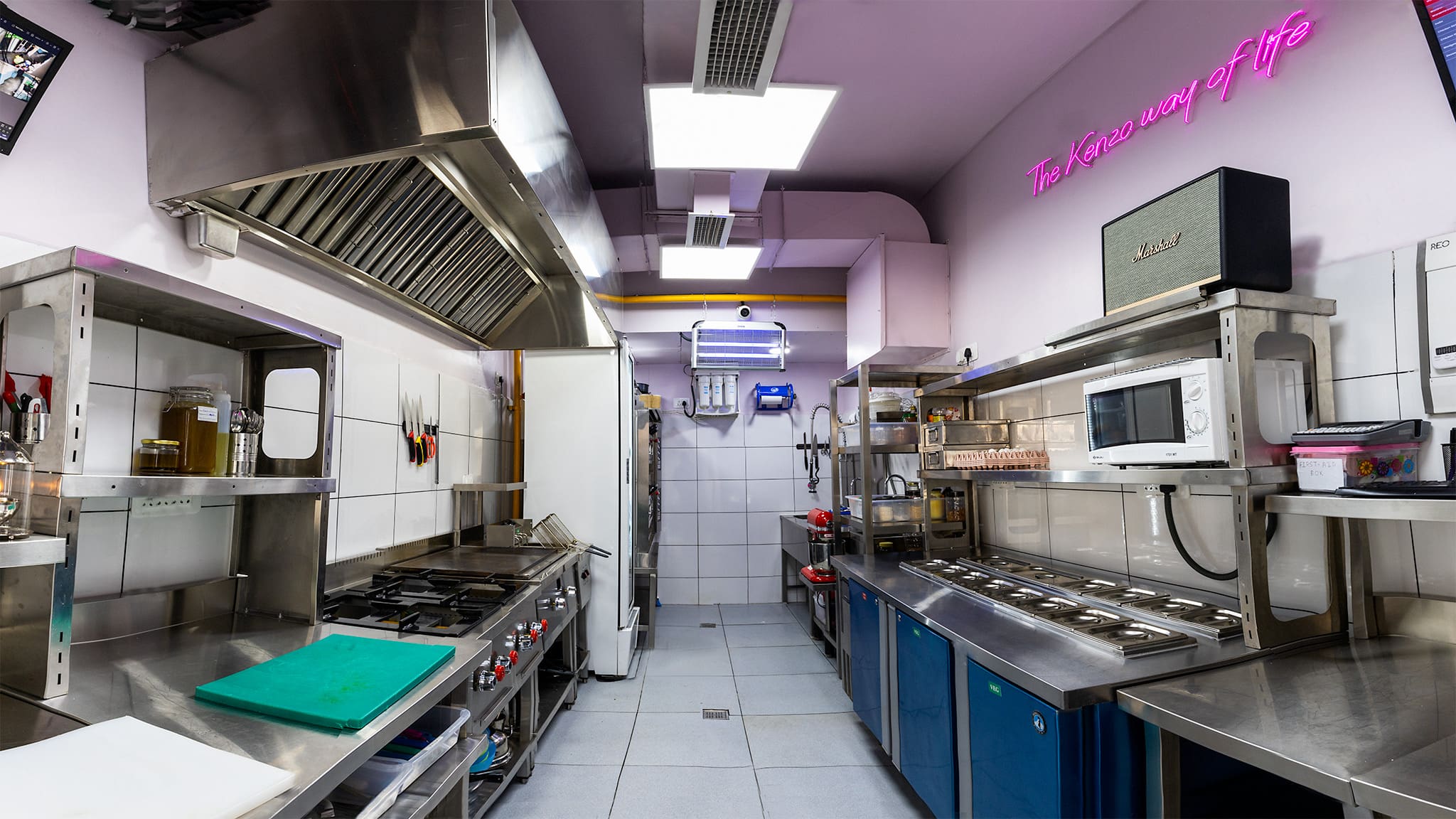 Chef Kenzo's Gurugram kitchen with 'The Kenzo Way of Life' neon sign